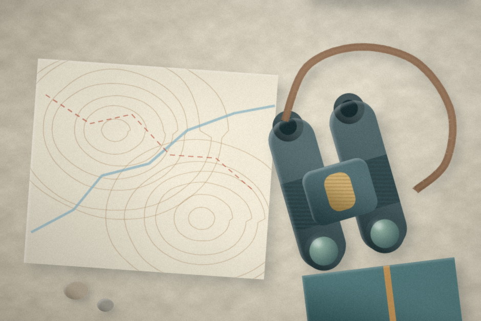 Binoculars, a topographic map, and a notebook laid out on a table.